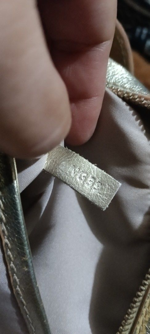 TOD'S Gold Quilted Leather Camera Bag (Category: Luxury Bags & Wallets) located in Legazpi City. Submitted by georgepineda791 (Listing ID 1443520984, Image 3). Description: TOD'S Gold Metallic Leather 3-way Bag - can be worn as a sling bag, body bag, or waist bag - Gold-tone leather exterior - Iconic T Timeless logo hardware - Elegant quilted pattern all over - Genuine leather, Made in Italy - Secure zipper closure - Adjustable strap for comforta