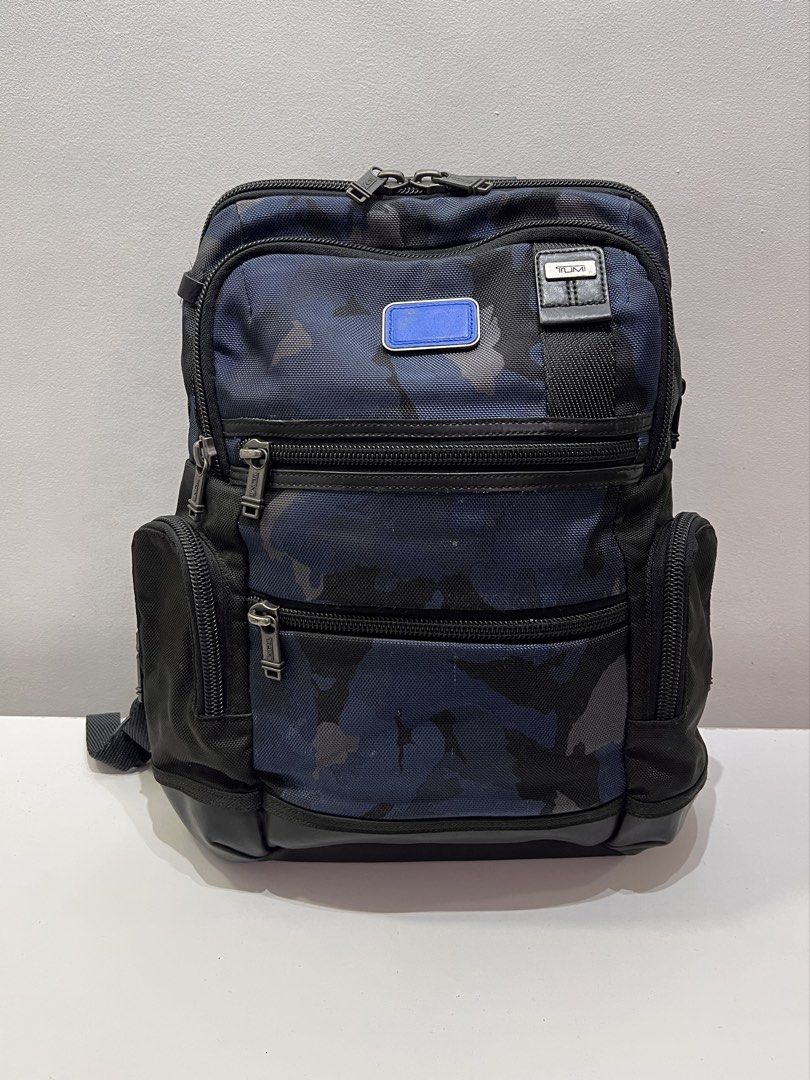 TUMI Alpha Bravo Knox Backpack (Category: Luxury Bags & Wallets) located in Cebu City. Submitted by brandedcorner_ph (Listing ID 1443694929, Image 1). Description: Pre-loved ((T))UMI Alpha Bravo Knox Backpack 100% Authentic or money back Condition • Excellent condition • No flaws • Minimal sign of usage only Product Details •Color: Black & Blue Camouflage •Hardware: Silver tone •Material: Canvas & leather •Approximate Dimensions in inches: H16 x 