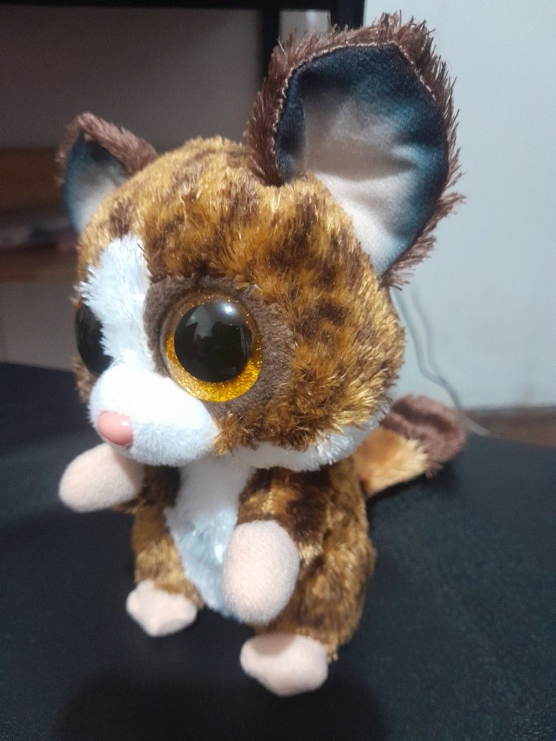 Ty Beanie Boos Plush Toy (Category: Plushies & Soft Toys) located in Quezon City. Submitted by warmturtle.ba931b (Listing ID 1443589460, Image 2). Description: TY Beanie Boos Binky the Bushbaby Plush 🐾 ✨ Authentic TY Beanie Boos plush 🐾 Character: Binky the Bushbaby 🤎 Adorable brown fur with a white face and belly 👀 Features the signature large glittery golden eyes 🩷 Cute peach/pink nose and little pink paws 🥰 Super cute and cuddly design; 