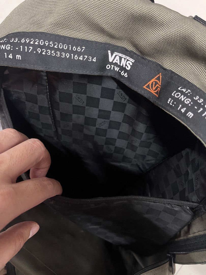 Vans OTW-66 Backpack Olive Green (Category: Backpacks) located in Bulacan. Submitted by sef19 (Listing ID 1443619590, Image 3). Description: - Vans backpack in olive green - Features Vans OTW-66 branding and coordinates on strap - Front mesh pocket for easy access - Interior lined with classic checkered pattern - Ideal for everyday carry and use.