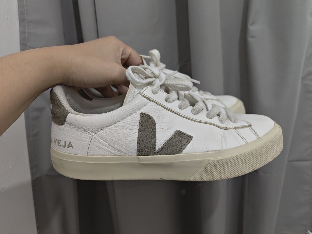 Veja Campo Sneakers White Leather Grey Suede (Category: Sneakers) located in Mandaluyong City. Submitted by declutterpreloved2.0 (Listing ID 1443644576, Image 2). Description: - Brand: Veja - Model: Campo - Color: White leather with grey suede accents - Style: Classic low-top sneakers - Closure: Lace-up - Features: VEJA logo on side and heel - Perfect for: Versatile and stylish casual wear 24 cm No box Seller is mandaluyong Lalamove j&t only Mop 