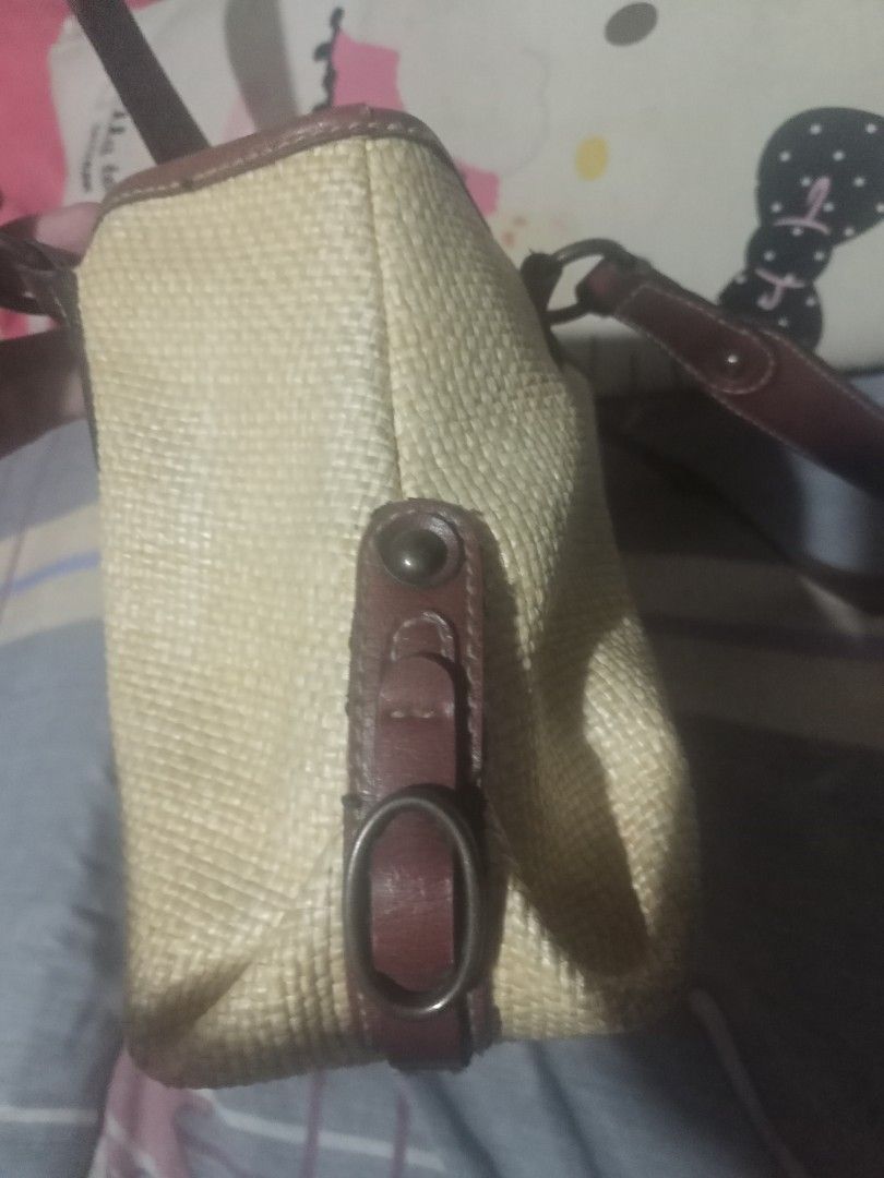 Vintage Fossil Handbag (Category: Tote Bags) located in San Carlos City. Submitted by apyogone (Listing ID 1443688391, Image 3). Description: Based on the interior leather patch, the manufacturer of this bag is Fossil. [1, 2] The patch displays several authenticating marks: Logo and History: It features the "Fossil" script logo and references "EST. 1954," which is a hallmark of their vintage-inspired designs. [1] Quality Guarantee: The text confi