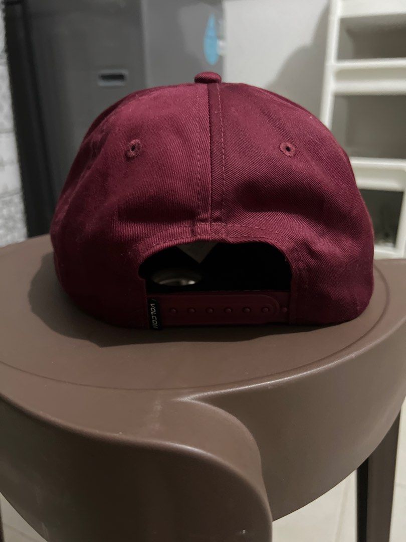 Volcom cap (Category: Caps & Hats) located in Singapore. Submitted by user63222 (Listing ID 1443694621, Image 2). Description: - Burgundy Volcom cap - Features Volcom Tones Co. logo patch on front - Adjustable snapback closure - Classic baseball cap style - Suitable for everyday wear.