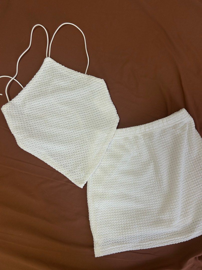 White halter top and mini skirt set (Category: Sets or Coordinates) located in Manila. Submitted by koolkeistore (Listing ID 1443666771, Image 1). Description: SHEIN. Can fit XS-S White textured halter, backless top and mini skirt set .