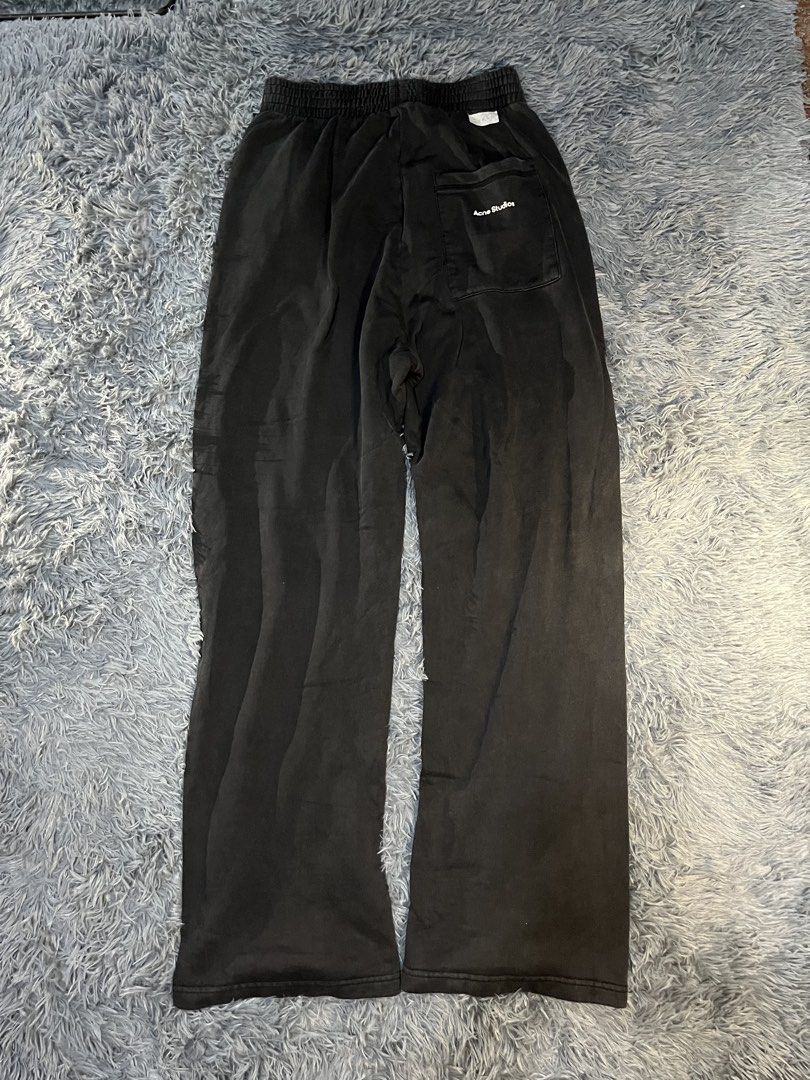 Acne Studios Black Sweatpants with Zipped Pockets (Category: Joggers) located in Caloocan City. Submitted by leo.noelalonzo (Listing ID 1443716987, Image 1). Description: - Brand: Acne Studios - Color: Black - Style: Sweatpants - Fit: Relaxed, Wide Leg - Features: Elastic waistband with drawstring, Zipped front pockets - Occasion: Casual wear.