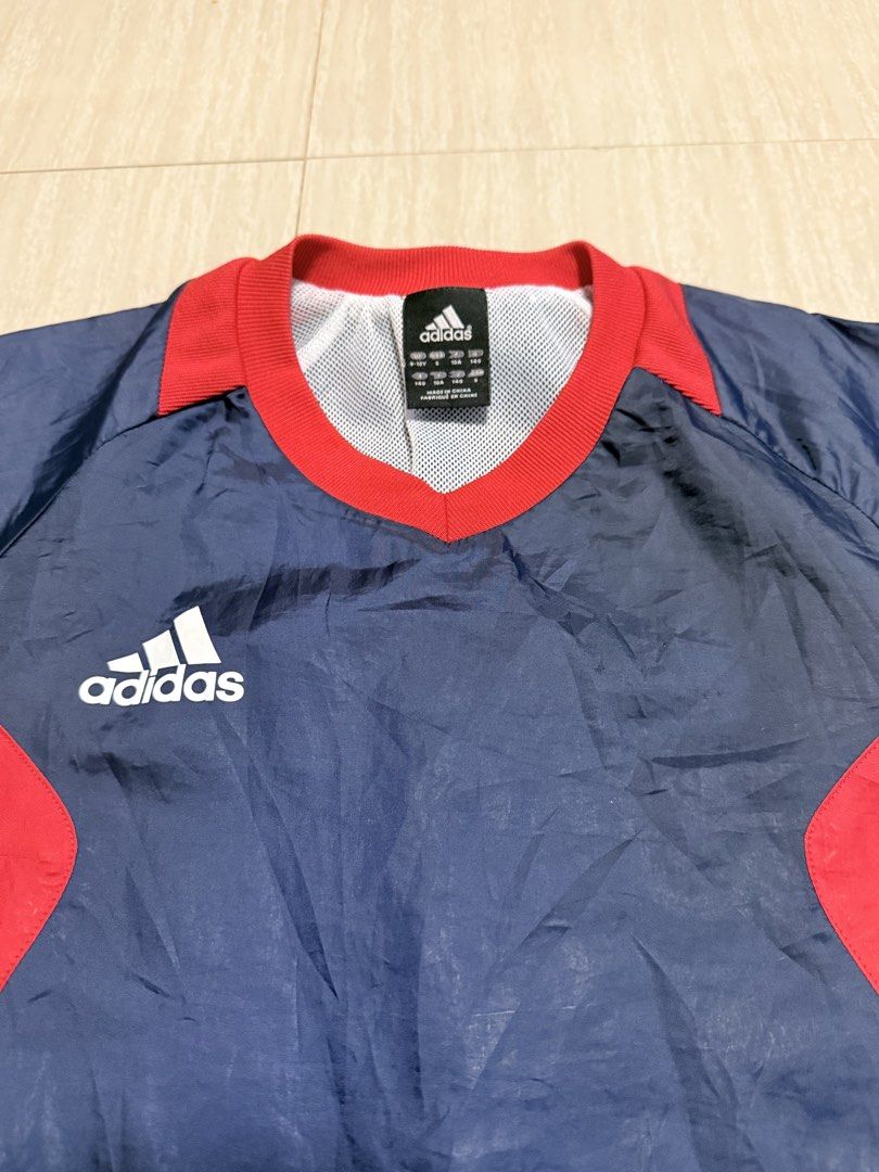 Adidas Navy Blue Red White Track Jacket (Category: Babies & Kids Fashion) located in Alfonso. Submitted by quickturtle_840b1e (Listing ID 1443813237, Image 3). Description: - Classic navy blue Adidas jacket - Features striking red and white accents - Iconic Adidas logo proudly displayed on the chest - Lightweight material, ideal for sports or casual outings - Pre-loved and ready for its next adventure! PM me for any queries. 😊.