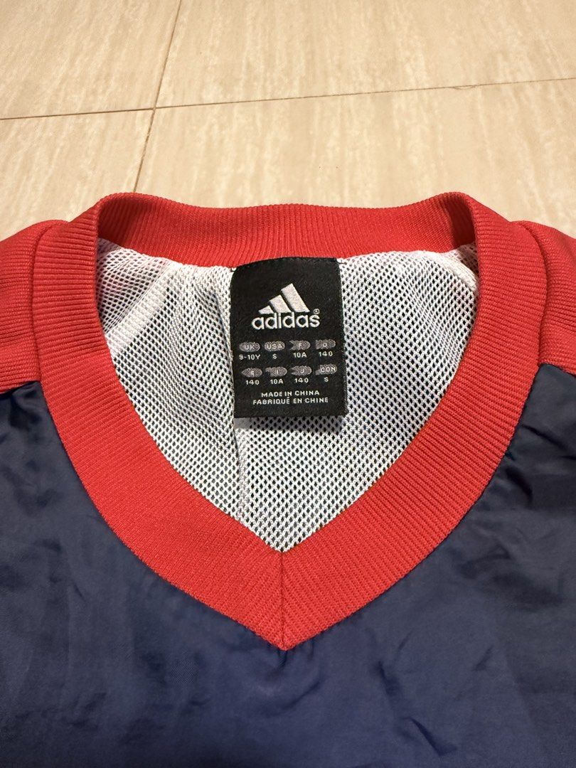 Adidas Navy Blue Red White Track Jacket (Category: Babies & Kids Fashion) located in Alfonso. Submitted by quickturtle_840b1e (Listing ID 1443813237, Image 2). Description: - Classic navy blue Adidas jacket - Features striking red and white accents - Iconic Adidas logo proudly displayed on the chest - Lightweight material, ideal for sports or casual outings - Pre-loved and ready for its next adventure! PM me for any queries. 😊.