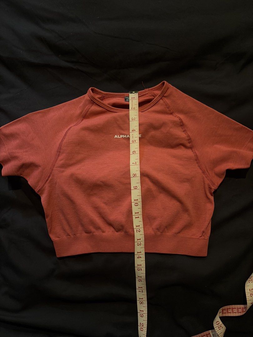 Alphalete Cropped Seamless Short Sleeve Top (Category: Others Tops) located in Quezon City. Submitted by shopsoph (Listing ID 1443760508, Image 3). Description: - Alphaelete cropped top - Short sleeves with raglan design - Made with seamless knit fabric - Beautiful magenta/pink red color - Approximately 15 inches in length (shoulder to hem) - Ideal for workouts or casual wear - RFS: hand me down from my cousin but not my style.