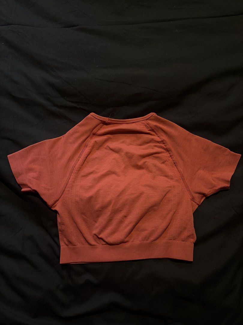 Alphalete Cropped Seamless Short Sleeve Top (Category: Others Tops) located in Quezon City. Submitted by shopsoph (Listing ID 1443760508, Image 2). Description: - Alphaelete cropped top - Short sleeves with raglan design - Made with seamless knit fabric - Beautiful magenta/pink red color - Approximately 15 inches in length (shoulder to hem) - Ideal for workouts or casual wear - RFS: hand me down from my cousin but not my style.
