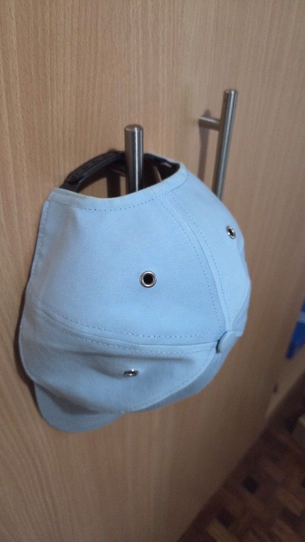 AMI Alexandre Mattiussi Light Blue Cap (Category: Caps & Hats) located in Lipa City. Submitted by cherrieseconds (Listing ID 1443750793, Image 3). Description: - Brand: AMI Alexandre Mattiussi - Color: Light Blue - Design: Classic baseball cap with curved brim - Features: Small embroidered logo on front, adjustable strap at back -I still have the paper bag with me so I can ship the same - This has visible signs of usage please check out the photo