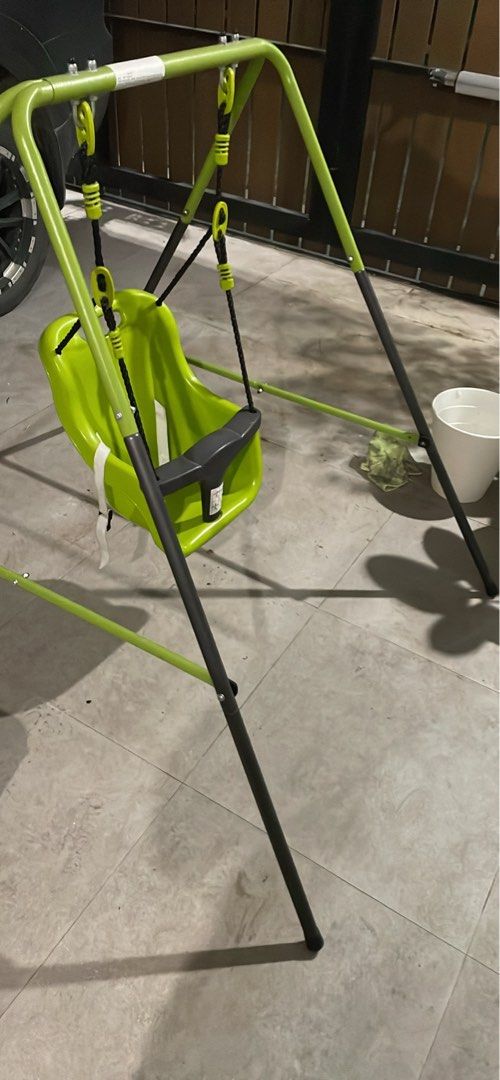 Baby Swing Set with Green Seat (Category: Other Kids Furniture) located in Taguig. Submitted by gooditems4u (Listing ID 1443837577, Image 3). Description: - Bright green portable baby swing seat with safety bar. - Sturdy and durable metal frame. - Simple to assemble and move. - Perfect for both indoor and outdoor fun. - Your baby will love it!.