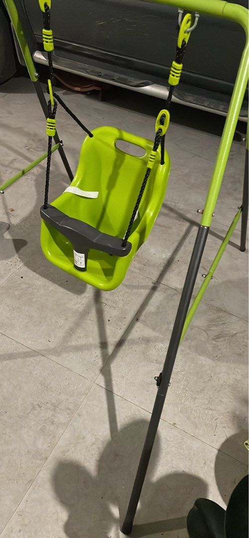 Baby Swing Set with Green Seat (Category: Other Kids Furniture) located in Taguig. Submitted by gooditems4u (Listing ID 1443837577, Image 2). Description: - Bright green portable baby swing seat with safety bar. - Sturdy and durable metal frame. - Simple to assemble and move. - Perfect for both indoor and outdoor fun. - Your baby will love it!.