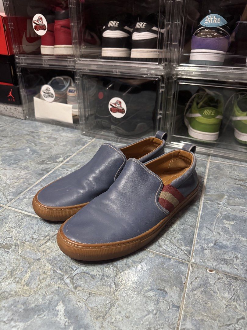 Bally Slip-On Leather Shoes - Blue (Category: Sneakers & Footwear) located in Makati City. Submitted by vinsanity41546 (Listing ID 1443882805, Image 1). Description: - Authentic Bally blue leather slip-on shoes - Features the iconic Bally stripe detail - Comfortable and stylish for everyday use - Inner lining displays the Bally logo.