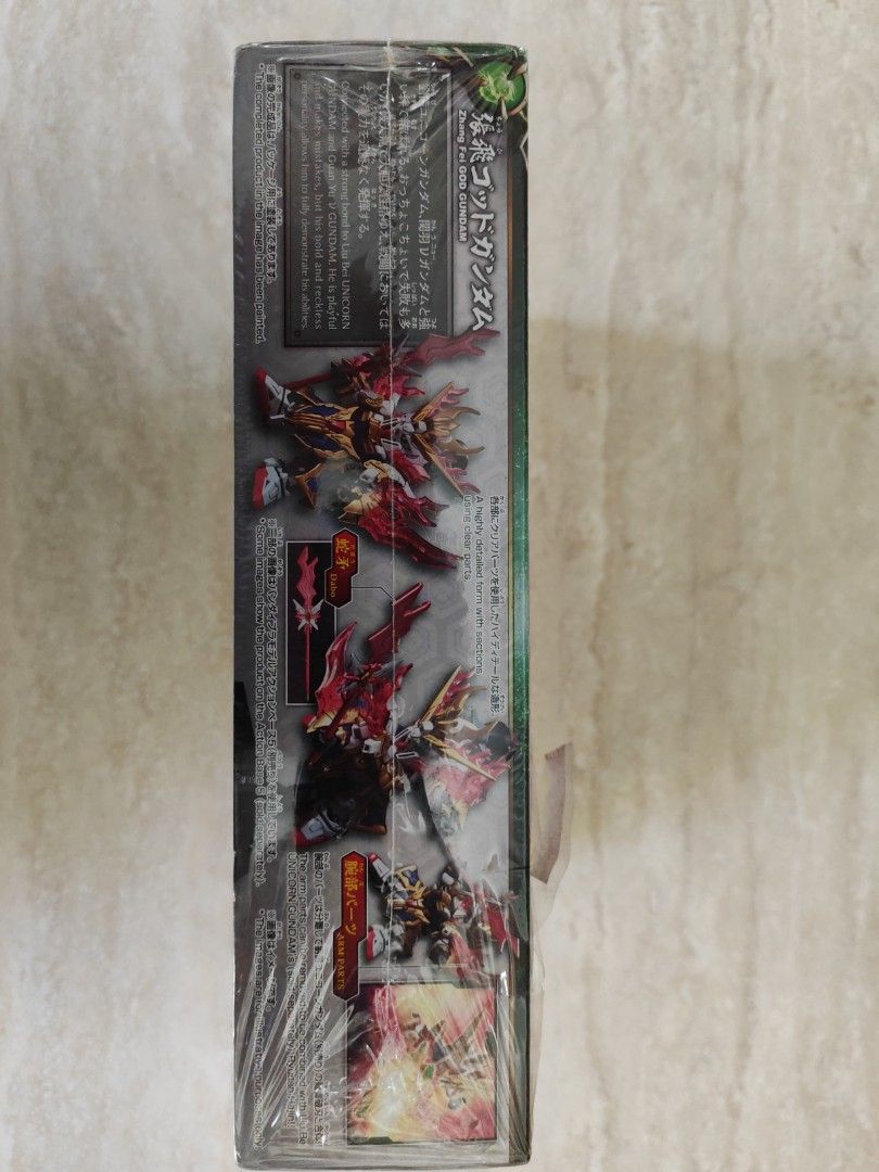Bandai Zhang Fei God Gundam Gunpla Model Kit (Category: Gundam Model Kits) located in Singapore. Submitted by packratdad (Listing ID 1443751539, Image 2). Description: - Unopened Bandai kit - Features Zhang Fei God Gundam - Perfect for collectors and builders - All parts and instructions included - Box is factory sealed, though wrapping is slightly torn.