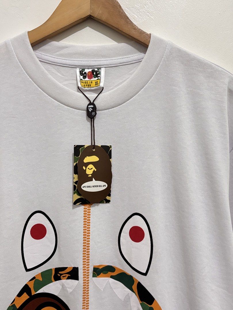 BAPE CAMO MILO SHARK TEE SHIRT (Category: Tshirts & Polo Shirts ) located in Quezon City. Submitted by dasharchive (Listing ID 1443858709, Image 2). Description: • COMPLETE W/ HANGTAGS SIZE: X-LARGE (ON TAG) Can fit up to LARGE EXCELLENT CONDITION 📍 NORTH FAIRVIEW, QUEZON CITY.