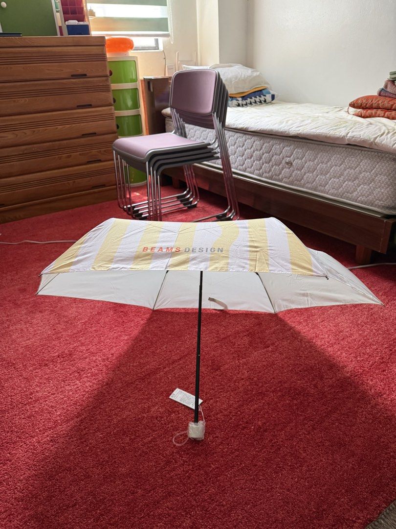 BEAMS DESIGN Striped Folding Umbrella Yellow White (Category: Umbrellas) located in Manila. Submitted by jcbagio20 (Listing ID 1443771494, Image 3). Description: 10 PIECES AVAILABLE!!! - Cute folding umbrella from BEAMS DESIGN - Features a stylish yellow and white stripe pattern - Compact and portable, ideal for on-the-go - Brand new, still in original packaging with tags attached - Perfect size to keep in your bag for unexpected rain.