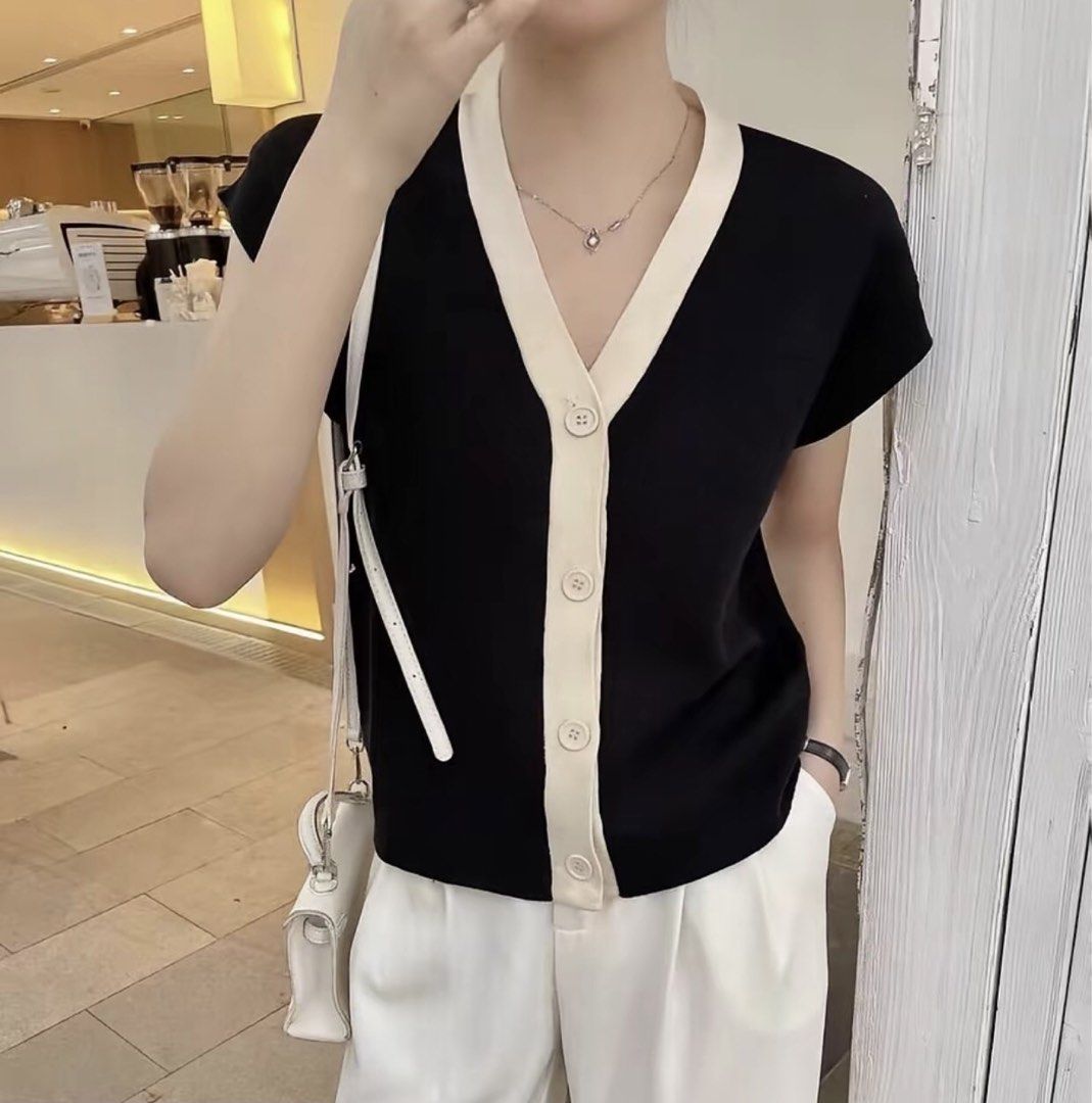 Black and Cream V-Neck Button Up Knitted Top (Category: Blouses) located in Manila. Submitted by juichiro (Listing ID 1443904284, Image 3). Description: Black and Cream V-Neck Button Up Knitted Top - Like new condition - Button-up front - Freesize Price: ₱150 Loc: Sampaloc, Manila Delivery fee should be shouldered by the buyer.