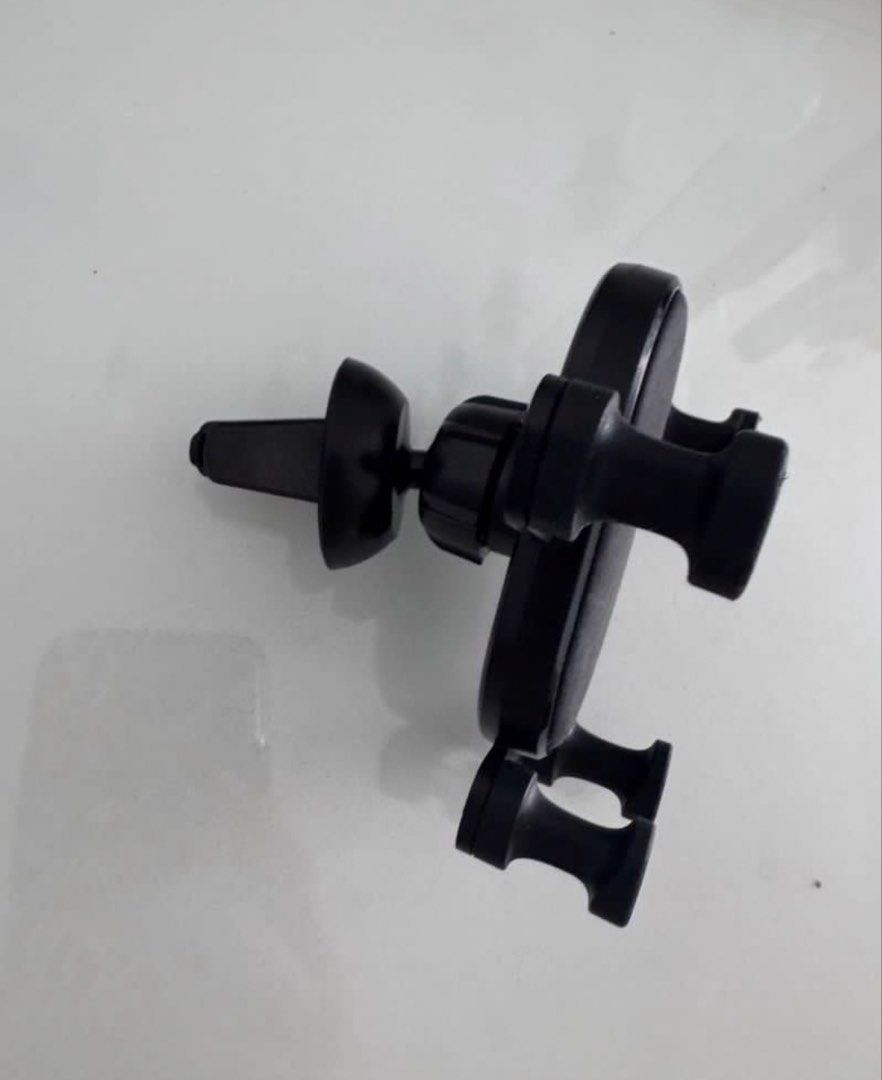 Black Car Air Vent Phone Mount Holder (Category: Mounts & Holders) located in Manila. Submitted by decluterthings888 (Listing ID 1443769892, Image 2). Description: - Universal car phone mount - Attaches securely to air vents - Holds your phone firmly in place - Simple to install and remove - Sleek black color - Compatible with most smartphones - Ideal for GPS navigation and hands-free calls while driving.