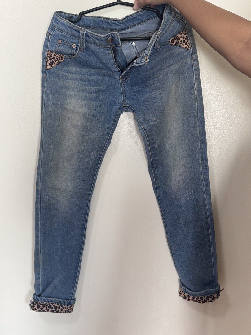 Blue Denim Jeans with Leopard Print Accents (Category: Jeans) located in Manila. Submitted by artipelagow (Listing ID 1443767522, Image 1). Description: - Light wash blue denim jeans - Unique leopard print detailing on pockets and cuffs - Cuffed hem for a stylish look - Secure button and zip closure - Designed for a comfortable fit.