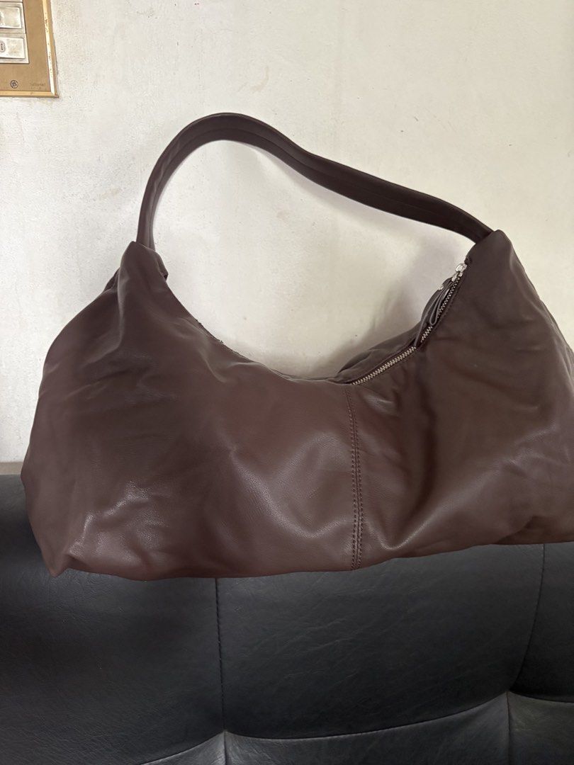 BOCU Brown Leather Hobo Shoulder Bag (Category: Shoulder Bags) located in Quezon City. Submitted by brandedthingsforless (Listing ID 1443909635, Image 1). Description: - Brand: BOCU - Material: Brown vegan Leather - Style: Hobo, Soft, Slouchy - Closure: Zipper - Features: Plenty of space, great for everyday use.