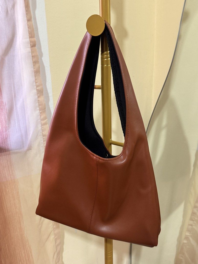 Bowie Shoulder Bag in Tan brown (Category: Shoulder Bags) located in Pasig City. Submitted by cattleyass (Listing ID 1443750682, Image 2). Description: Bought in Indonesia Detachable bow Geniune Leather Material Can fit Ipad 11in No discoloration No issues H13x W8.5in.