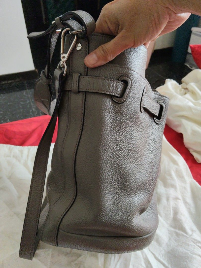 Bruno Magli Grey Leather Bucket Bag (Category: Shoulder Bags) located in Batangas. Submitted by ms.d_preloveditems (Listing ID 1443722212, Image 3). Description: - Authentic Bruno Magli grey leather bucket bag - Textured leather finish - Secure drawstring closure with stylish buckle details - Adjustable shoulder strap for comfortable wear - Interior features the signature Bruno Magli branded stamp - Comes with its original dust bag for protection