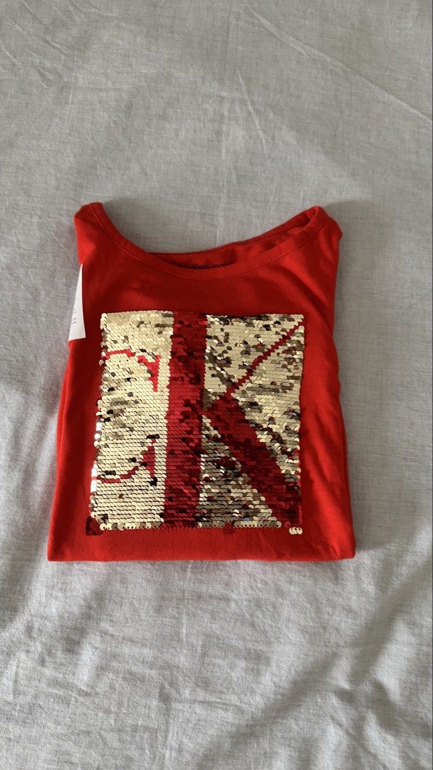 Calvin Klein Red Sequin Logo Long Sleeve Shirt (Category: Blouses) located in Manila. Submitted by mmsmims (Listing ID 1443746212, Image 2). Description: - Calvin Klein red long sleeve shirt-size 12-14 fits to xs-small women - Features a reversible sequin logo on the front (red and gold) - Elasticated hem for a comfortable fit - Brand new with original tags attached -.