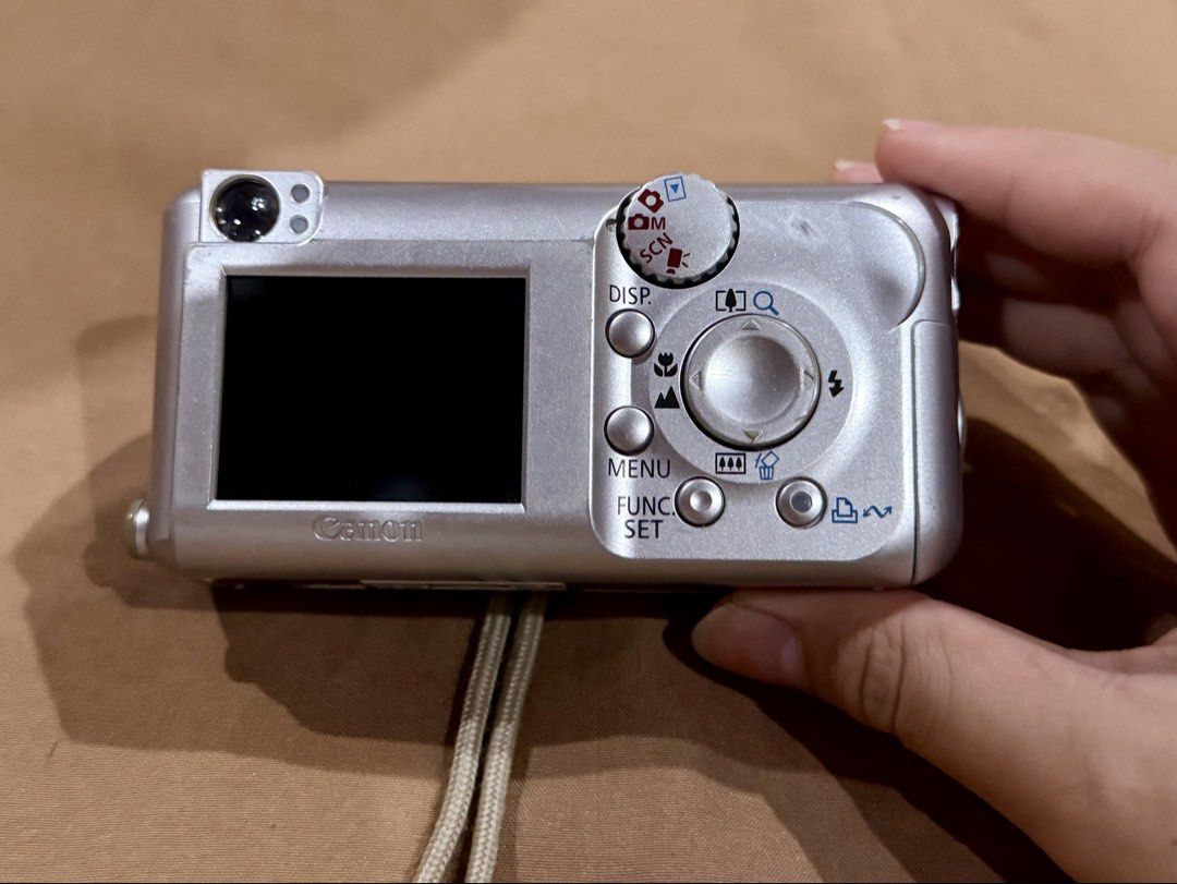 CANON PowerShot A430 Optical Zoom Digital Camera (Category: Cameras) located in Rizal. Submitted by alearchives (Listing ID 1443785792, Image 2). Description: CANON Blue and Silver PowerShot A430 Optical Zoom Digital Camera 💙🩶 Condition: - Secondhand; with scratches and sign of wears but fully functional -LCD appears to have no issue or damage. Still display photos well - Clean lens and all buttons are still functional and are working (not hard