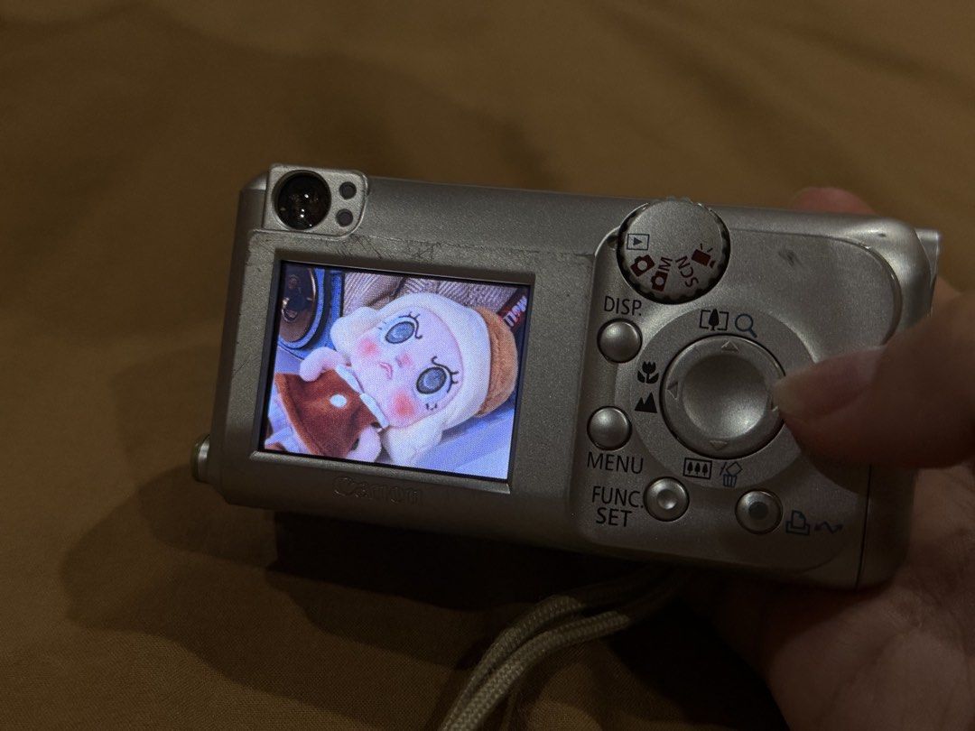 CANON PowerShot A430 Optical Zoom Digital Camera (Category: Cameras) located in Rizal. Submitted by alearchives (Listing ID 1443785792, Image 3). Description: CANON Blue and Silver PowerShot A430 Optical Zoom Digital Camera 💙🩶 Condition: - Secondhand; with scratches and sign of wears but fully functional -LCD appears to have no issue or damage. Still display photos well - Clean lens and all buttons are still functional and are working (not hard