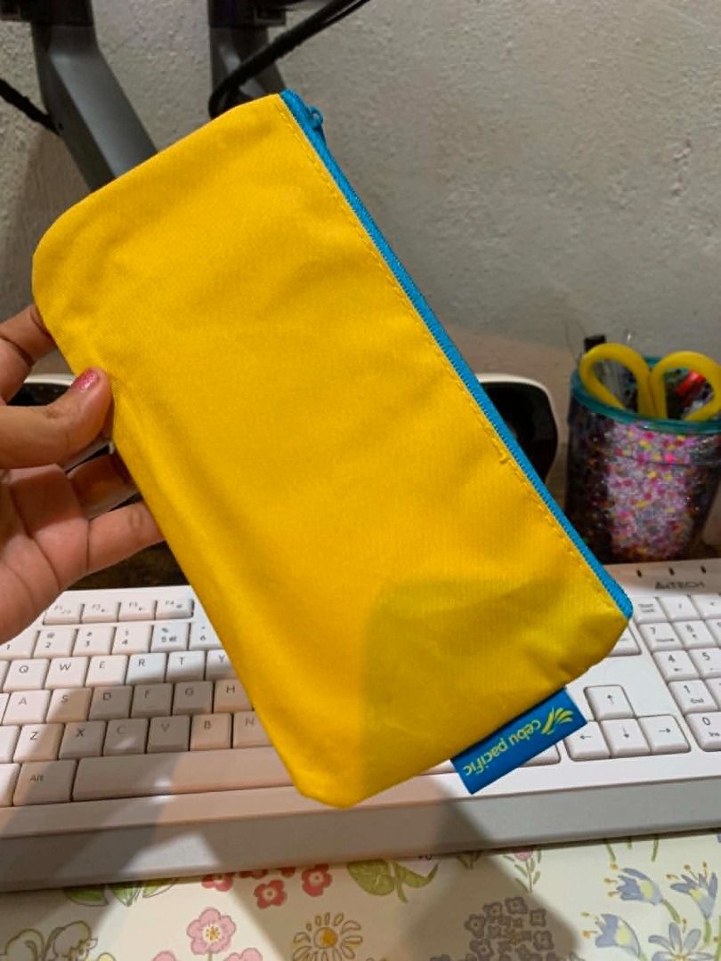 Cebu Pacific The Bibo Juan Yellow Pouch (Category: Purses & Pouches) located in Bacolod City. Submitted by kyaramatcha (Listing ID 1443844187, Image 3). Description: Yellow pouch with blue zipper and 'The Bibo Juan' text. Won this on their Q&A game! Effort hahahha.