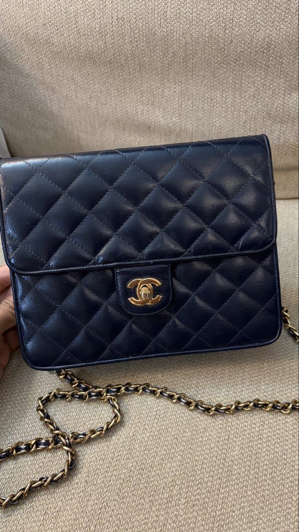 Chanel Navy Blue Lambskin (Category: Luxury Bags & Wallets) located in Taguig. Submitted by nm100 (Listing ID 1443848574, Image 2). Description: If you love vintage bags, you'll appreciate this. Picked this up in Taiwan, original color is white hence you see white markings in the chain and inside. I did the recoloring as part of my "project" turned out OK naman. Long chain, dirty inside because of the paint but not sticky. Wala rin particles na k