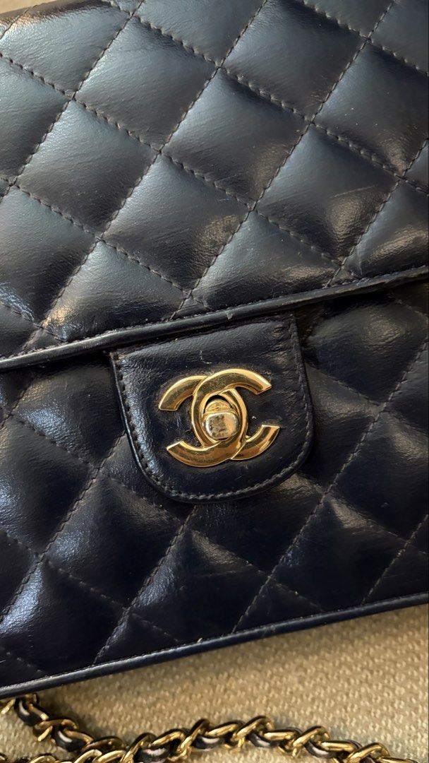 Chanel Navy Blue Lambskin (Category: Luxury Bags & Wallets) located in Taguig. Submitted by nm100 (Listing ID 1443848574, Image 3). Description: If you love vintage bags, you'll appreciate this. Picked this up in Taiwan, original color is white hence you see white markings in the chain and inside. I did the recoloring as part of my "project" turned out OK naman. Long chain, dirty inside because of the paint but not sticky. Wala rin particles na k