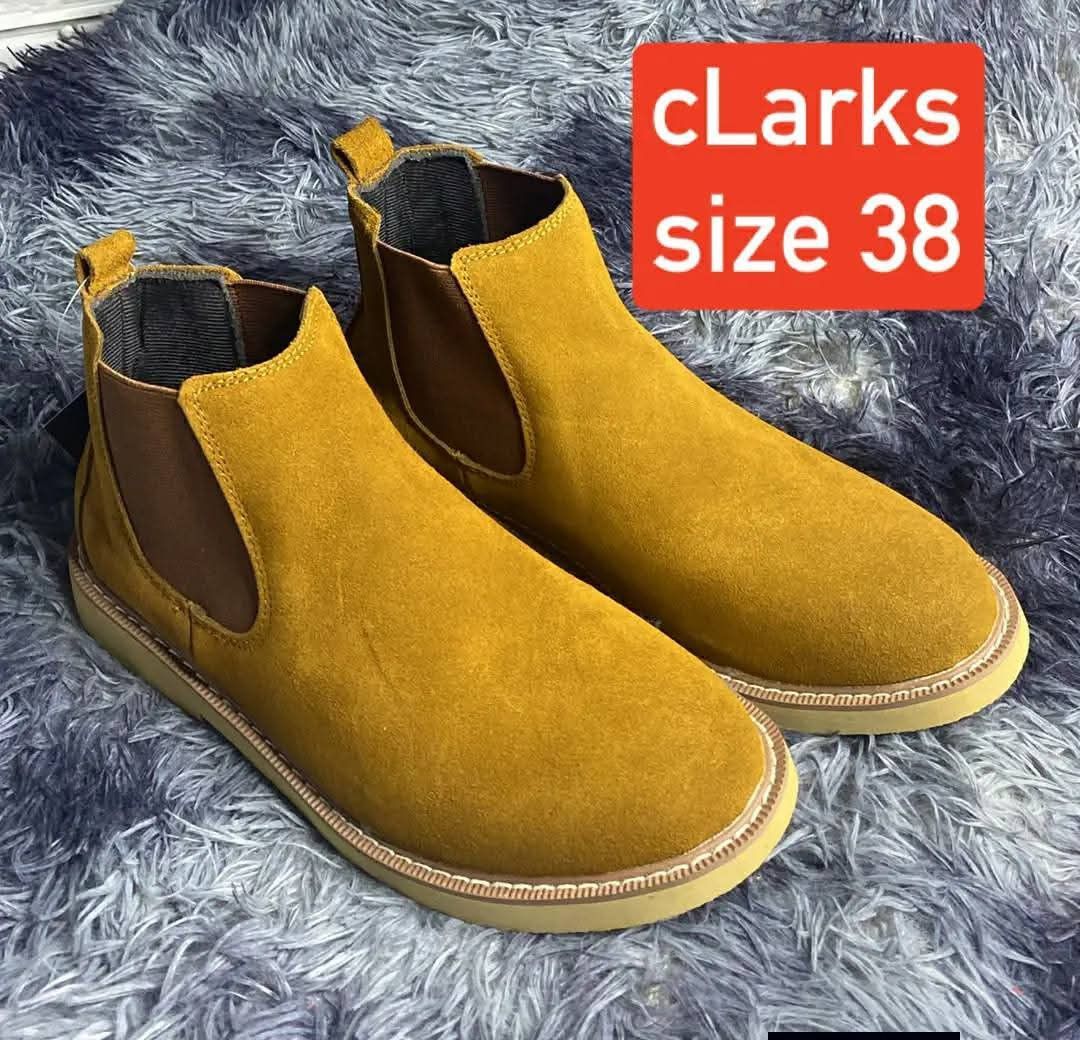 Clarks Suede Chelsea Boots Size 38 (Category: Boots) located in Taguig. Submitted by jerafelsan87737 (Listing ID 1443899342, Image 1). Description: - Brand: Clarks - Style: Chelsea Boots - Color: Yellowish-Brown Suede - Size: 38 - Features: Elasticated side panels for easy wear - Perfect for: Casual outings or smart-casual looks.