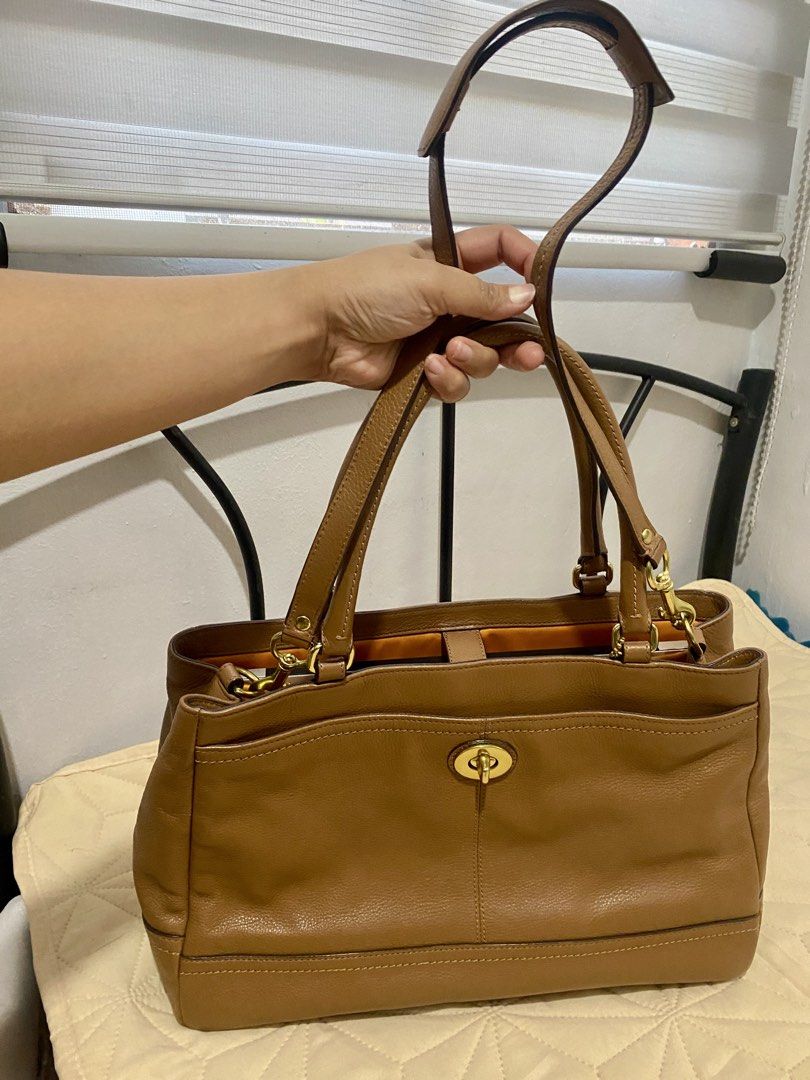 Vintage Coach Park Leather (Category: Luxury Bags & Wallets) located in Santa Rosa. Submitted by jemaustria (Listing ID 1443778761, Image 1). Description: Authentic, preloved Coach Park Leather Carryall (Style #F19728) in classic British Tan pebbled leather with gold hardware. It features a signature front turnlock pocket, spacious multi-compartment interior, and a genuine YKK interior pocket zipper. It comfortably fits a 2015 13-inch MacBook Air