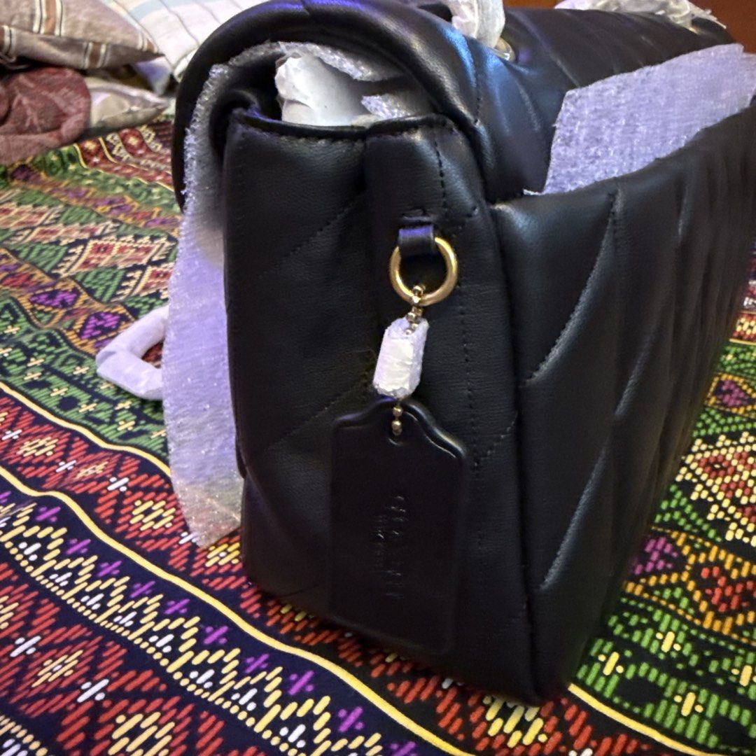 Coach Tabby Shoulder Bag 33 with Pillow Quilting (Category: Luxury Bags & Wallets) located in Cavite. Submitted by avagold (Listing ID 1443802483, Image 3). Description: 💯 Guaranteed original Brandnew with tags intact, care card, dust bag, gift box and receipt Black / Brass gold hardwares Features convertible strap for versatile styling Lalamove ready / Ship ✅Also available: Coach Tabby 26 Shoulder Bag with Pillow Quilting.