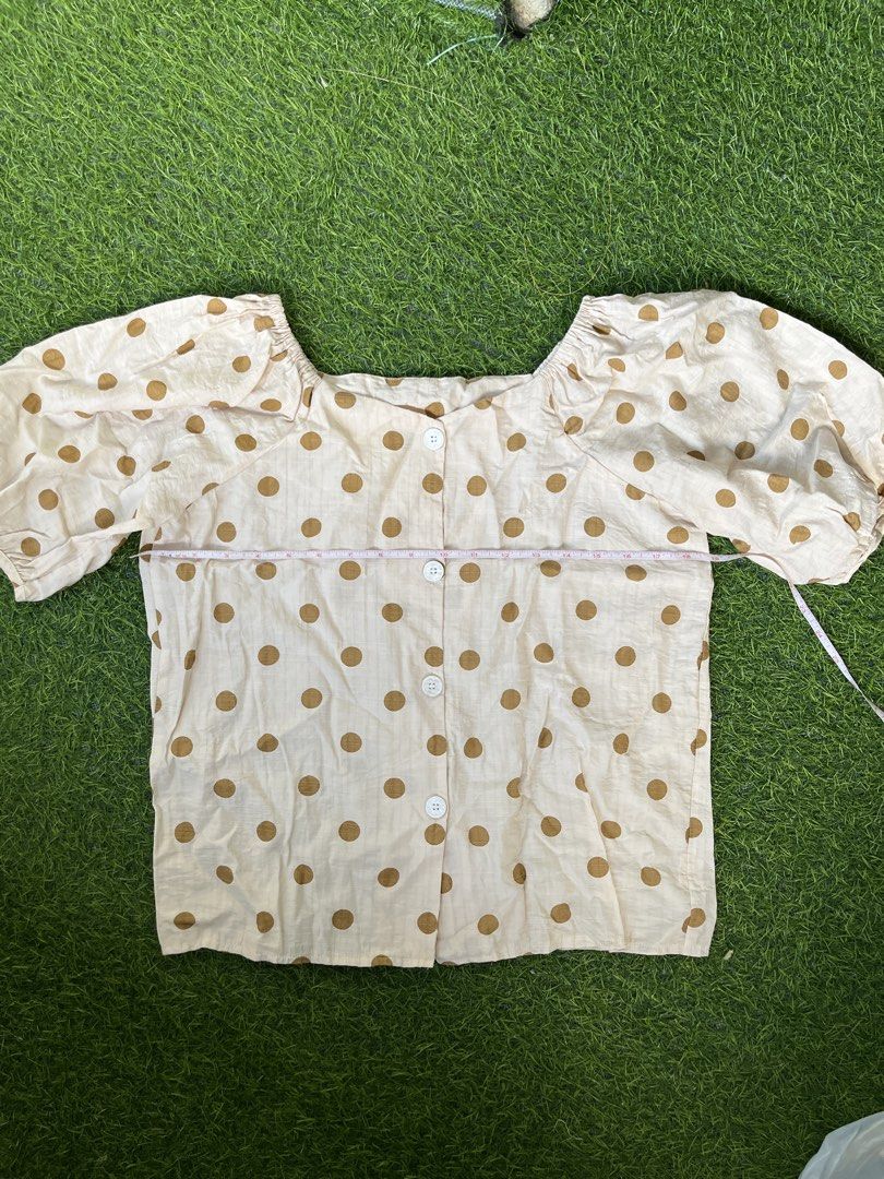 Cream Polka Dot Puff Sleeve LINEN Square Neck Top (Category: Blouses) located in Bacolod City. Submitted by marbiii (Listing ID 1443800520, Image 1). Description: - Cream top with brown polka dots - Square neckline - Puff sleeves - Button-up front - Measurements: Pit to pit approx 20 inches, length approx 21 inches - Lightweight fabric - Ideal for casual wear.
