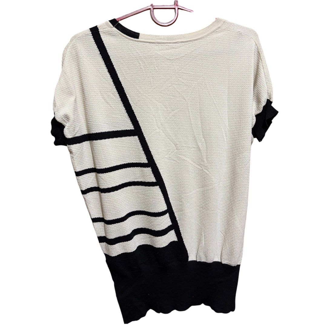 Cream-colored short sleeved Knit top (Category: Blouses) located in Quezon City. Submitted by bielle.co_09 (Listing ID 1443891519, Image 2). Description: 📌 Size runs from M-Semi XL 📌No flaws 📌 Classy design w/ bold black lines 📌Knitted top 📌 Message for more actual pics 💵MOP: Gcash Maya transfer Bank transfer (Landbank).