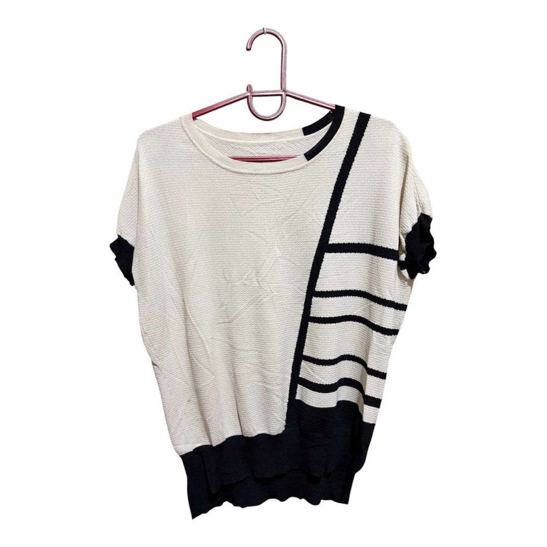 Cream-colored short sleeved Knit top (Category: Blouses) located in Quezon City. Submitted by bielle.co_09 (Listing ID 1443891519, Image 1). Description: 📌 Size runs from M-Semi XL 📌No flaws 📌 Classy design w/ bold black lines 📌Knitted top 📌 Message for more actual pics 💵MOP: Gcash Maya transfer Bank transfer (Landbank).