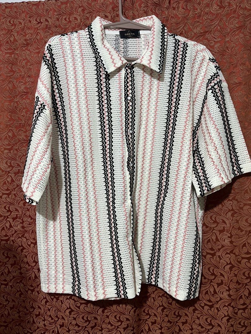 Crocheted Striped Short Sleeve Button Up Shirt (Category: Tshirts & Polo Shirts ) located in Manila. Submitted by maldimathilda (Listing ID 1443888371, Image 2). Description: - White crocheted shirt - Pink and black wavy stripes - Short sleeves - Button front closure - Relaxed fit - Ideal for casual outfits - Unique texture and pattern.