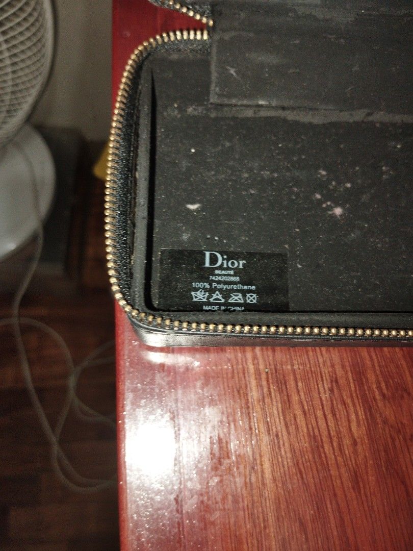 Dior cosmetics organizer (Category: Luxury Bags & Wallets) located in Makati City. Submitted by fiercewind.7bf54e (Listing ID 1443766380, Image 2). Description: - Authentic Dior cosmetics organizer - Material: 100% Polyurethane - Features a stylish design with gold accents - Comes with a detachable gold chain, can be used as a clutch - Condition: Used, with visible signs of wear (discoloration, scuffs) as shown in pictures - Made in Italy.