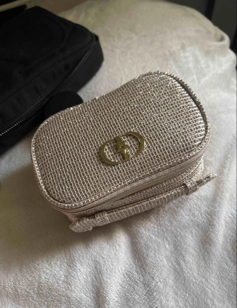 Dior Glitter Cosmetic Bag with Makeup (Category: Luxury Bags & Wallets) located in Manila. Submitted by dianaclutz (Listing ID 1443734242, Image 1). Description: - Cute Dior makeup bag - Sparkly glitter material - Perfect for travel or everyday use - Zipper closure - No box included.