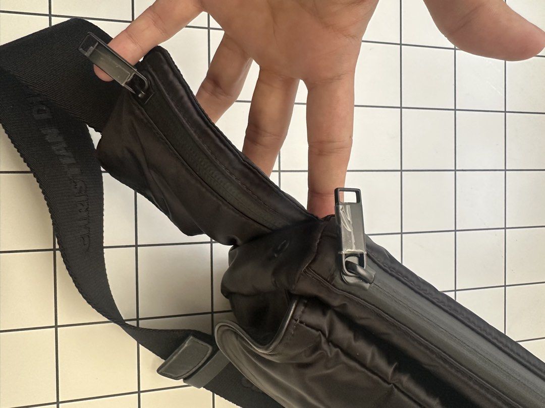 Dior Saddle Universe Belt Bag (Category: Luxury Bags & Wallets) located in Bacolod City. Submitted by puglia17 (Listing ID 1443757502, Image 3). Description: - Authentic Black Dior Waist Bag - Bought in Prague 2 years ago, used a only a few times on trips - Made from durable nylon material - Features the iconic Dior logo prominently on the front - Adjustable strap with subtle Christian Dior branding - Multiple zippered compartments for secure sto