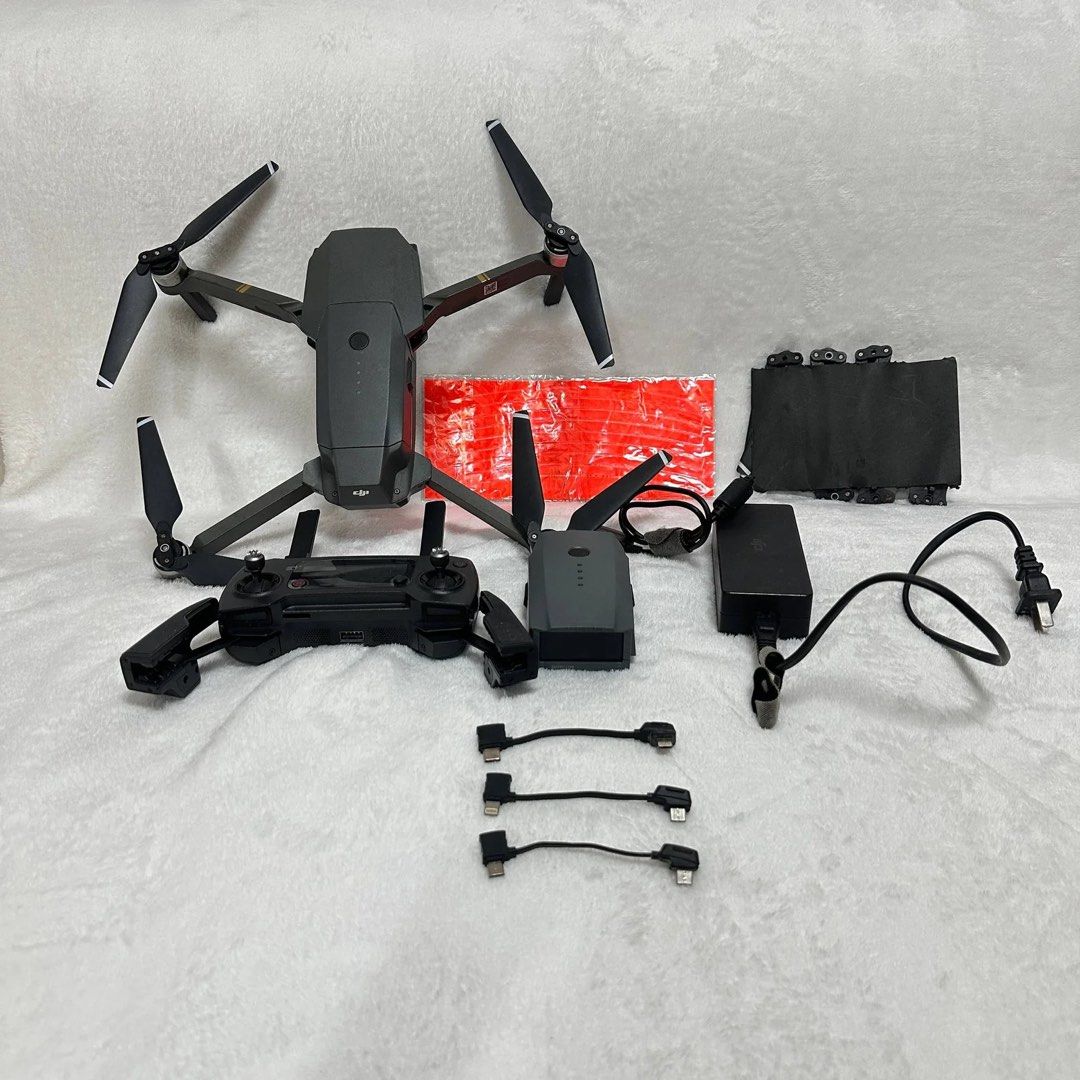 DJI Mavic Pro Drone with Controller and Accessories (Category: Drones) located in Mandaluyong City. Submitted by strawberryvanilla08 (Listing ID 1443710297, Image 1). Description: The DJI Mavic Pro (1st Gen), launched in 2016, is a compact, foldable quadcopter designed for portability and high-quality aerial photography. It features a 3-axis gimbal with a 12MP 4K camera, 27-minute flight time, 40 mph top speed, and 4.3-mile OcuSync 1.0 transmissi