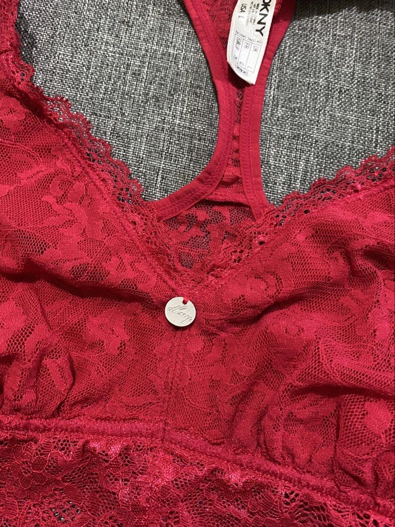 DKNY Red Lace Racerback Bralette Size L (Category: Sleeveless) located in Manila. Submitted by andee. (Listing ID 1443745438, Image 2). Description: - Brand: DKNY - Color: Red - Style: Bralette - Material: Lace all over - Details: Scalloped hem, racerback, small metal DKNY charm in front - Size: L - Usage: Great for layering or lounging.