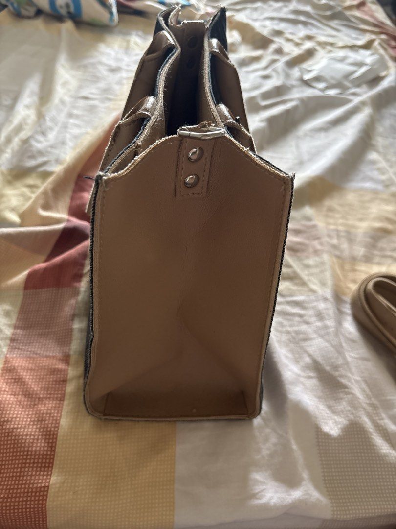 EGG Handcrafted Tote Bag Philippines (Category: Tote Bags) located in Manila. Submitted by faststone_6abf86 (Listing ID 1443767792, Image 3). Description: - Chic denim tote bag with elegant tan leather accents. - Versatile carrying options: comfortable top handles and a detachable shoulder strap. - Organized interior with multiple compartments to keep your essentials tidy. - Ideal size for everyday use, fitting all your daily necessities. - Proud