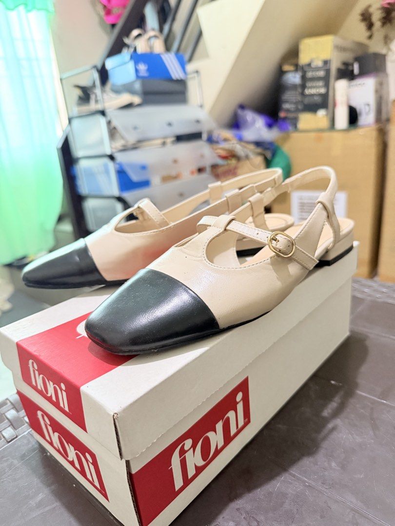 Fioni Slingback Ginny Nude/Black Size 9 (Category: Heels) located in Lucena. Submitted by lcndeclutter (Listing ID 1443703553, Image 2). Description: - Fioni slingback shoes - Available in nude and black - T-strap design with buckle closure - Size 9 - Includes original box - Perfect for both casual outings and dressing up.