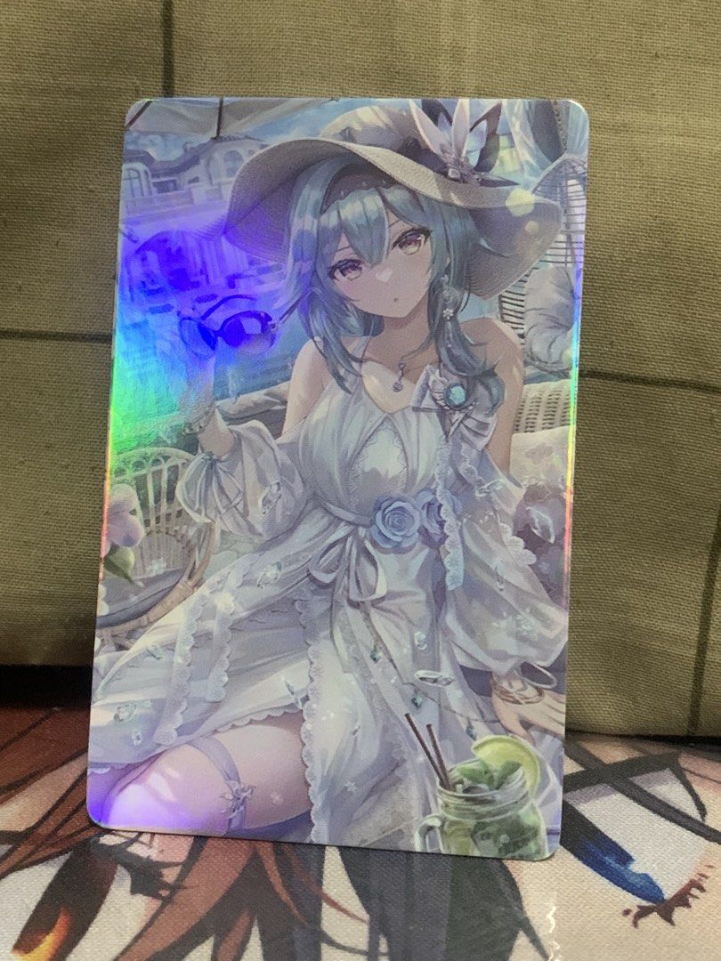Genshin Impact Holographic Card - Eula (Please see description) (Category: Raw Singles) located in Manila. Submitted by inari05 (Listing ID 1443843164, Image 1). Description: - Holographic Eula card from Genshin Impact - Front: Eula in a summer dress - Back: Genshin Impact logo - Shiny and eye-catching design - Ideal for collectors and fans of the game -Asking 30 -Sf charged to buyer -Good condition -First owner rfs:need space Payment:Gcash.