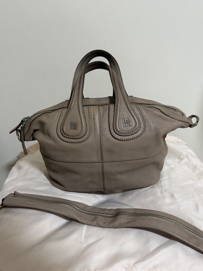 Givenchy Nightingale Leather Handbag (Category: Luxury Bags & Wallets) located in Del Monte. Submitted by gentlehawk-37b0 (Listing ID 1443755593, Image 1). Description: - Authentic Taupe Givenchy Nightingale Bag - Made of genuine leather - Iconic design with top handles - Includes a detachable shoulder strap for versatile carrying - Shows some signs of wear on the handles and leather - Perfect for everyday use.