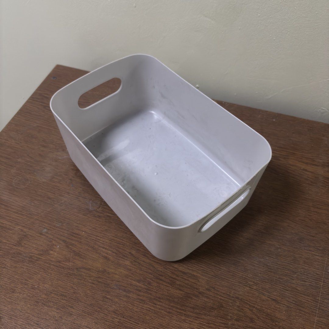 Gray Plastic Storage Bin (Category: Office Furniture & Fixtures) located in Cebu City. Submitted by vaststar_307340 (Listing ID 1443834708, Image 1). Description: - Gray plastic storage bin - Features built-in handles for easy transport - Versatile for organizing various items - Neutral color complements any decor - Durable and practical storage solution.