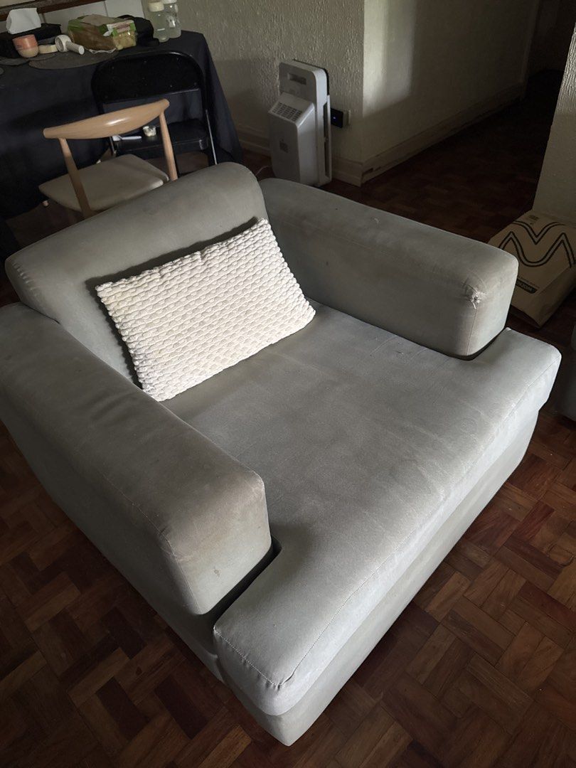 Grey Fabric Sofa Set 5 Seater (Category: Sofas) located in Makati City. Submitted by decluttermakati (Listing ID 1443729825, Image 3). Description: - Grey fabric sofa set - Includes 5-seater sofa and matching armchair - Some signs of wear on fabric (more noticeable on armchair) - Still comfortable and functional - Perfect for living room or lounge - Pickup only.